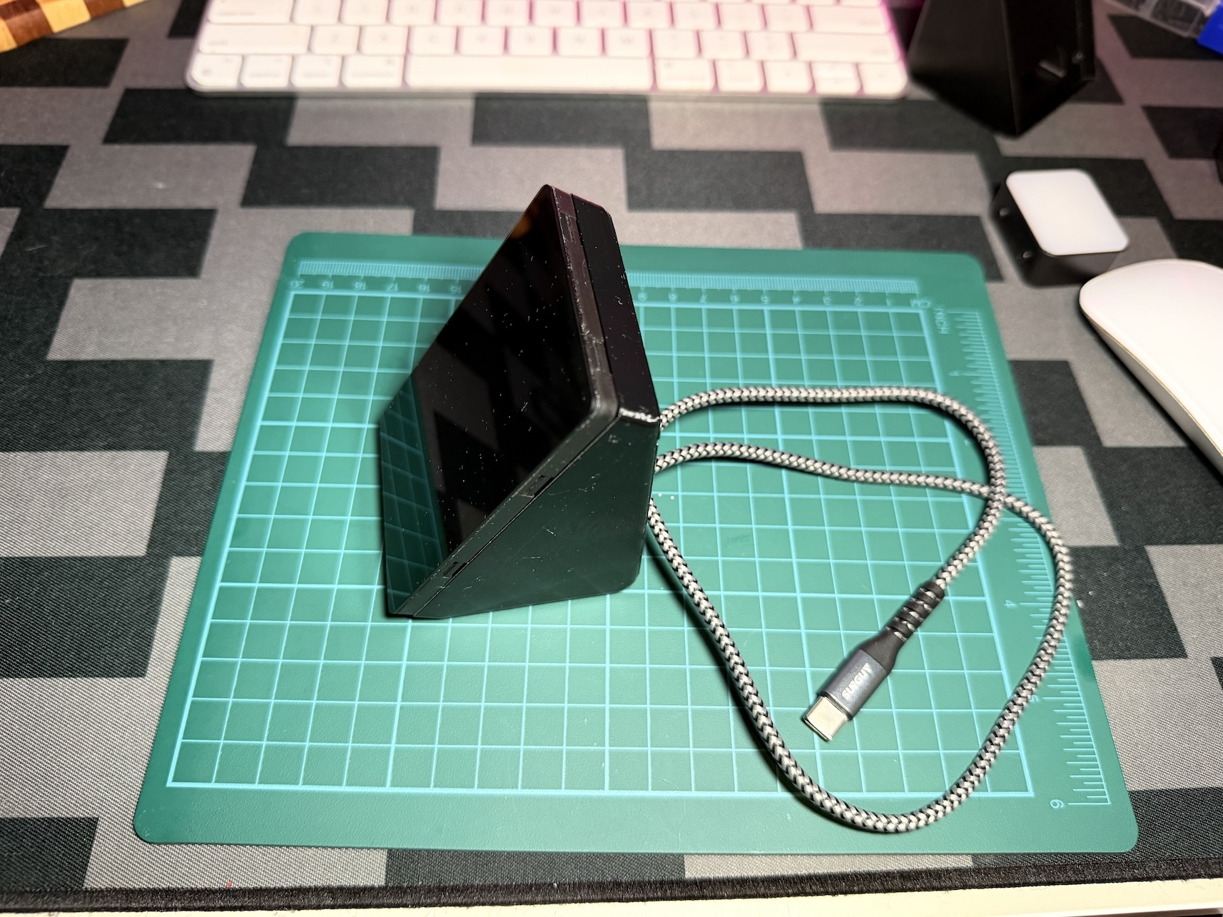 The finished NebulaDeck standing upright with its cable coming out of the back